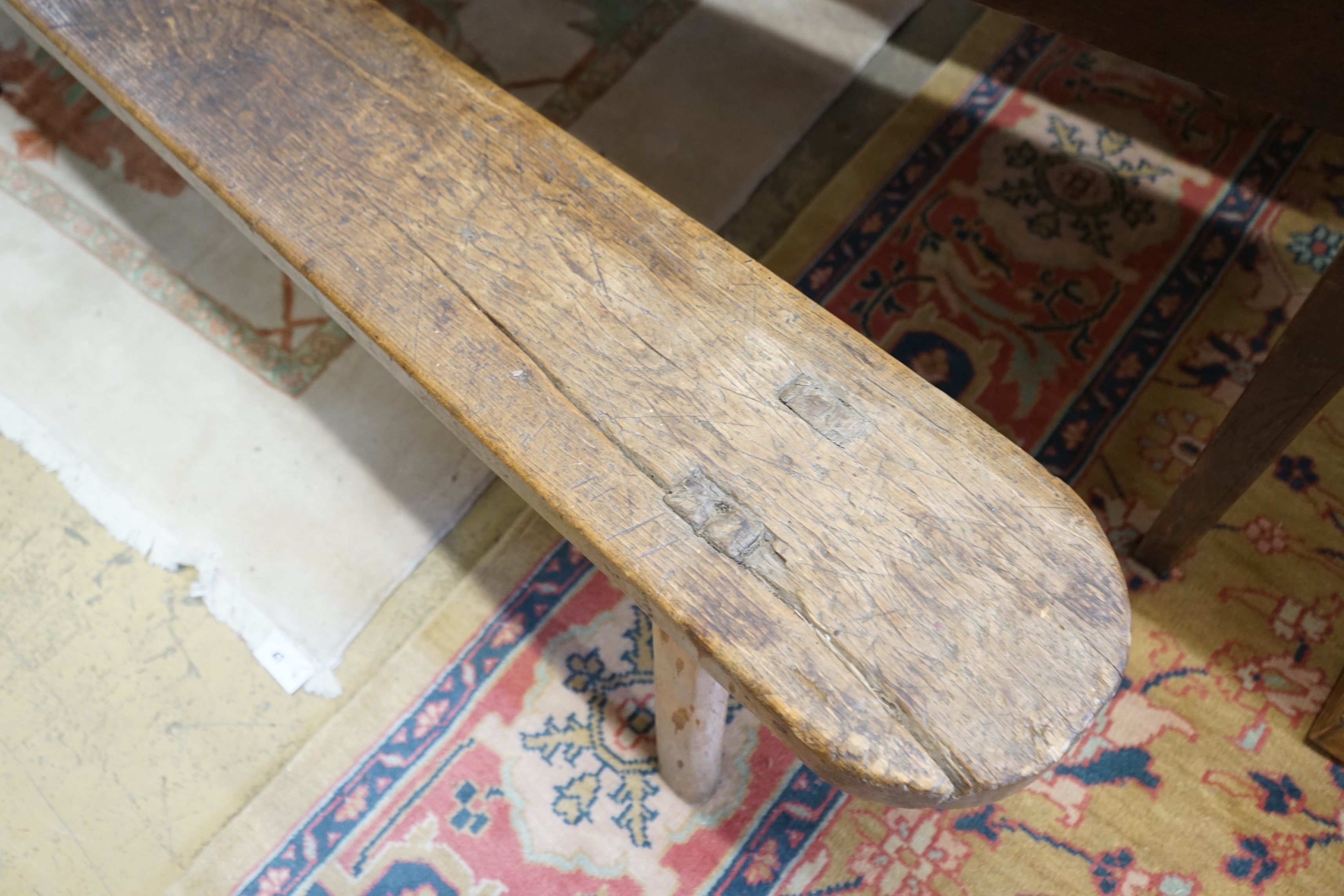 A pair of 19th century provincial elm and beech bench seats, length 199cm, depth 23cm, height 48cm